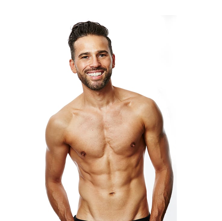 Dean Edwards smiling, shirtless, after his training programme with ROAR Fitness