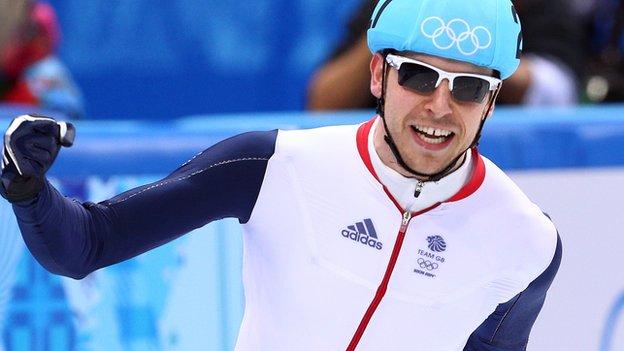 Short track speed skater Jon Eley celebrating in Great Britain kit