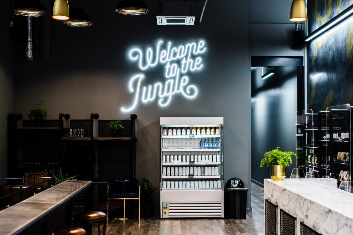 Client lounge with neon sign at Roar Fitness Kensington gym